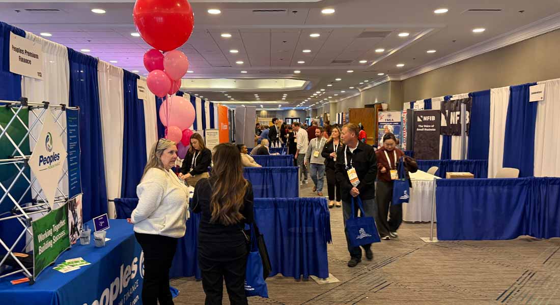 A busy trade show floor at the Houston Day 2025 Insurance Conference
