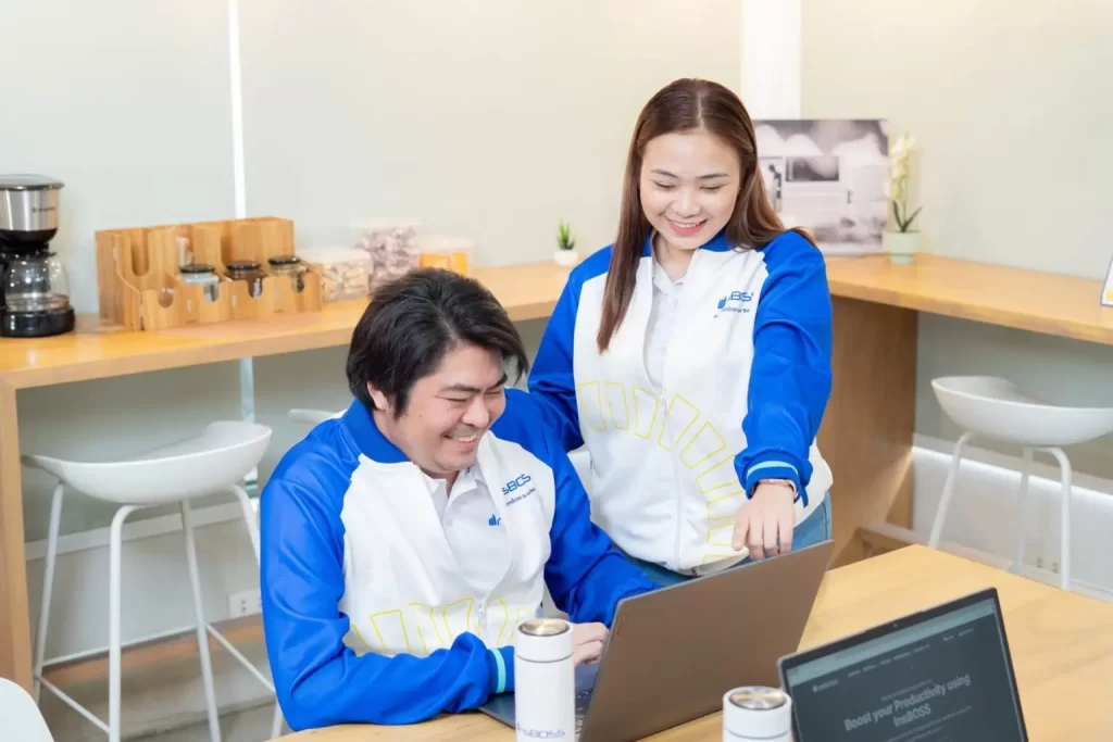 An **InsBOSS Virtual Assistant** guiding a client or colleague on a laptop, demonstrating personalized, expert **VA support**.